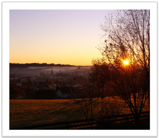 Foto Trauerbegleitung: Abendsonne über Landschaft